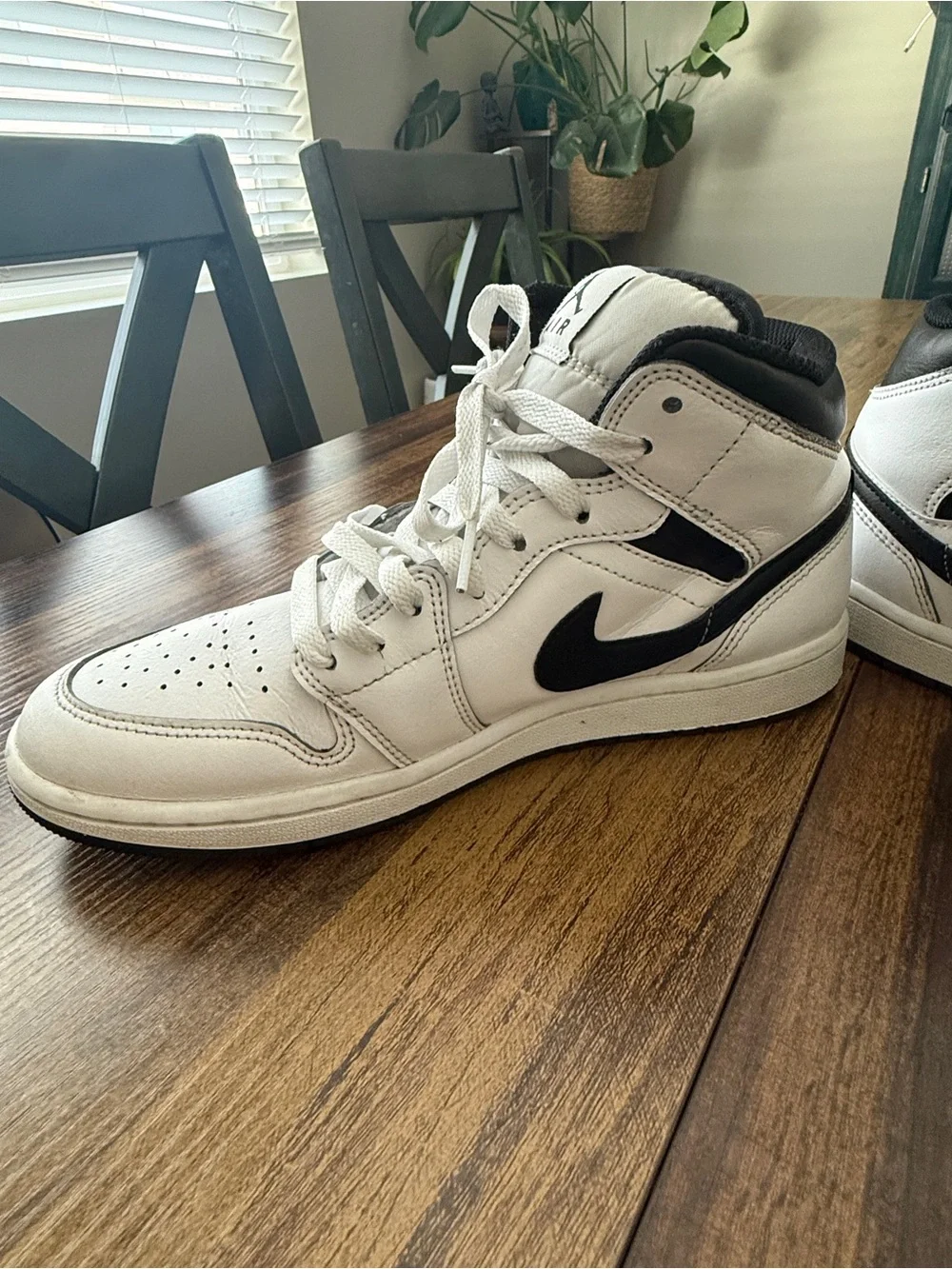 Nike Air Jordan 1 White and Black Mid-Top Sneakers